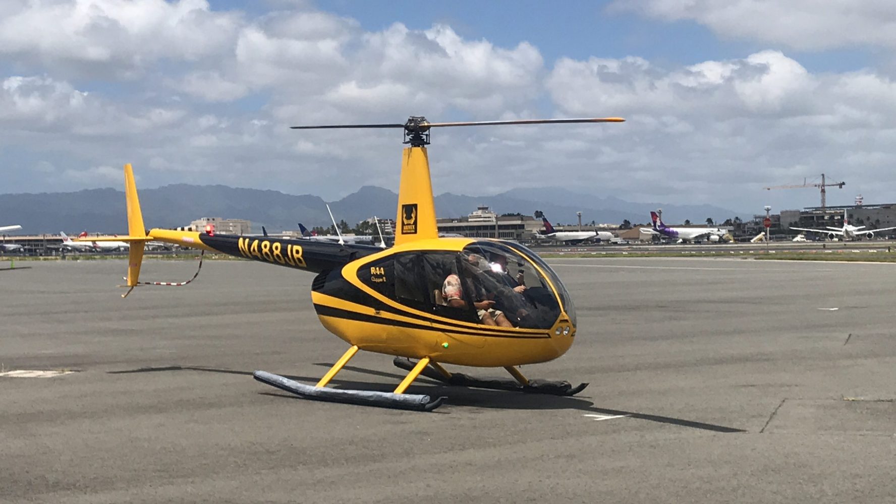 a helicopter parked in a parking lot