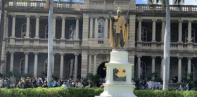 a statue in front of a building