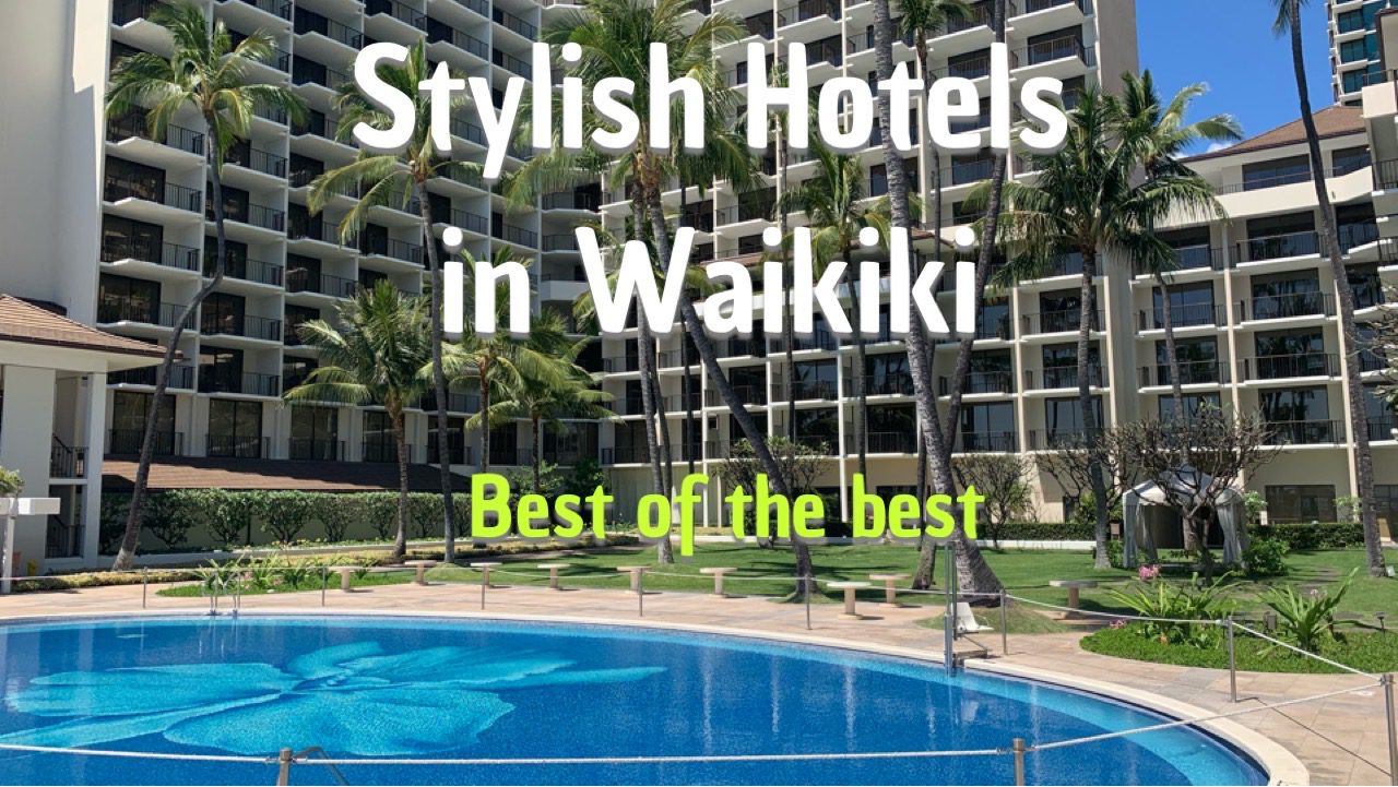 Stylish-Hotels-in-Waikiki a pool next to a building