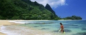 a person standing next to a body of water