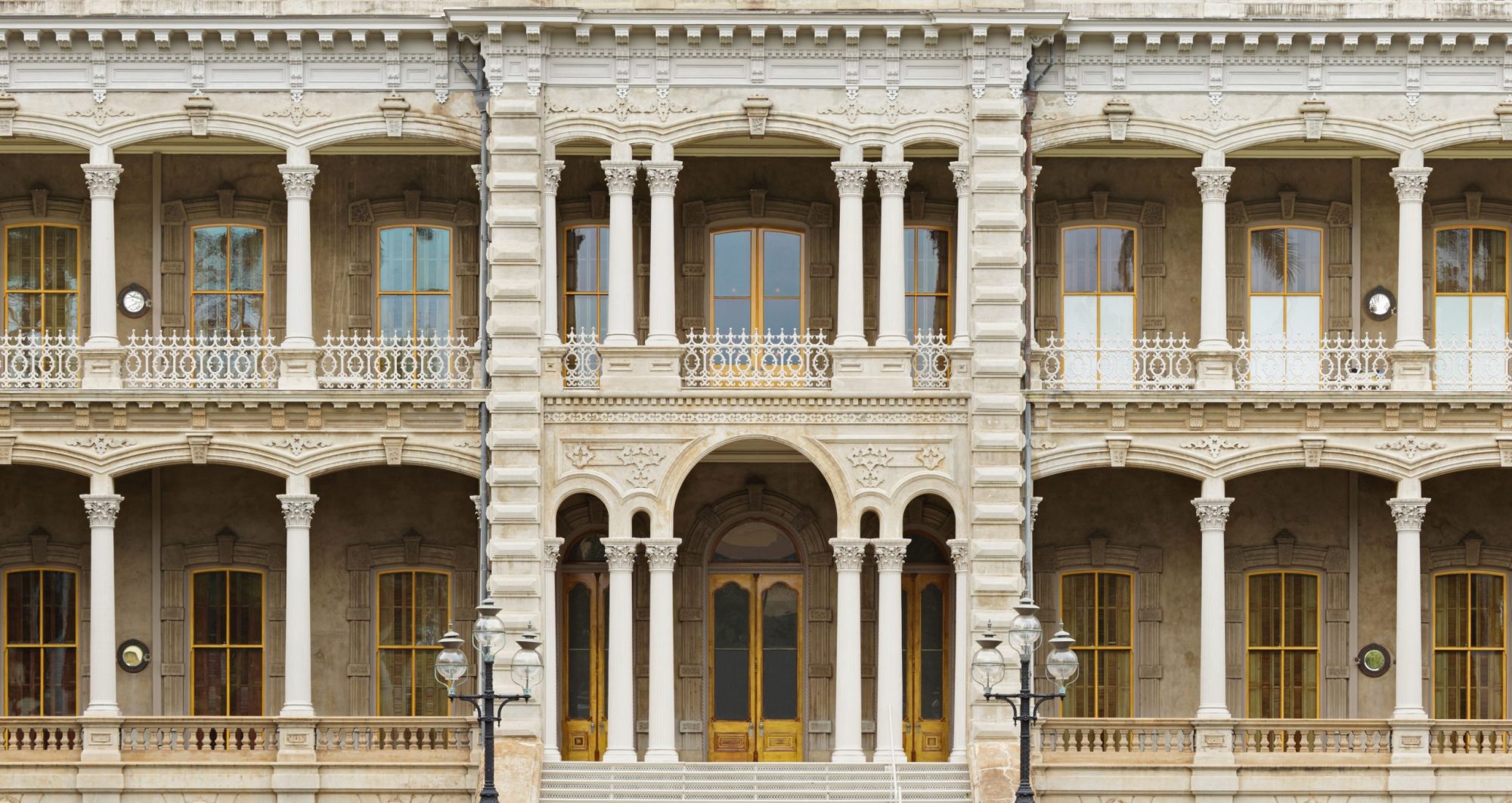 Iolani palace a large stone building with many windows