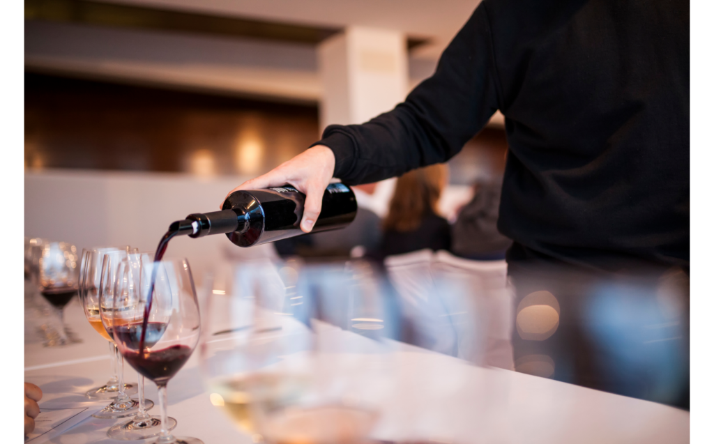 356f722a-a9a5-4ad0-b412-5e227ba6dde0-2-1024×637 a person holding a glass of wine