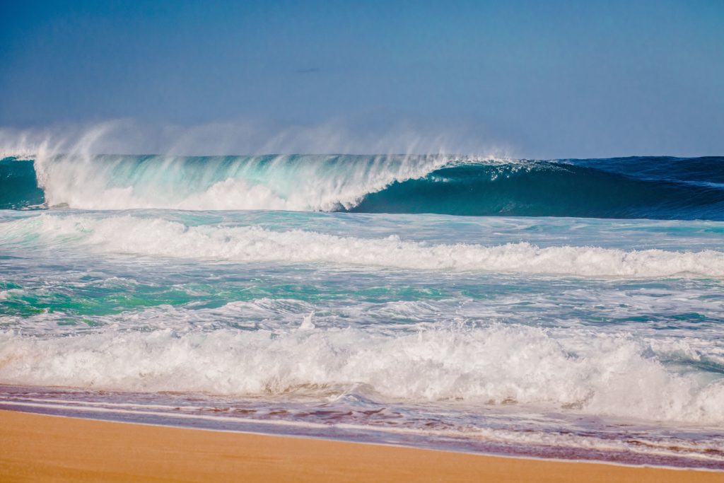 Untitled-design-7-1024×683 a man riding a wave on a surfboard in the ocean