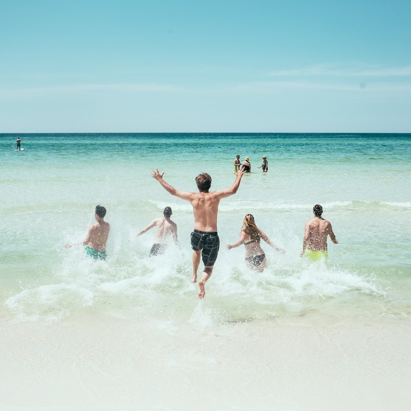 a man riding a wave on a surfboard in the ocean