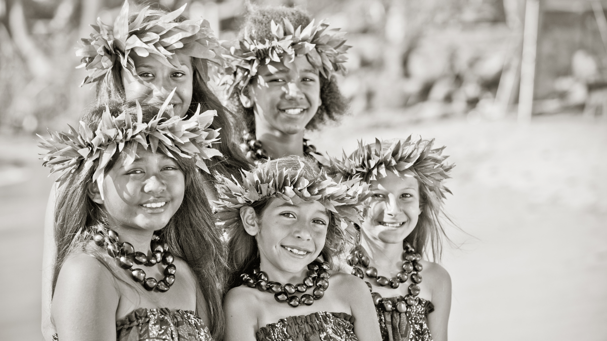 hula a group of people posing for the camera