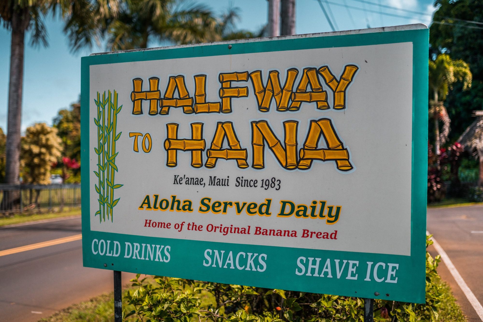Road to Hana Drive – Half Way a sign on the side of a road