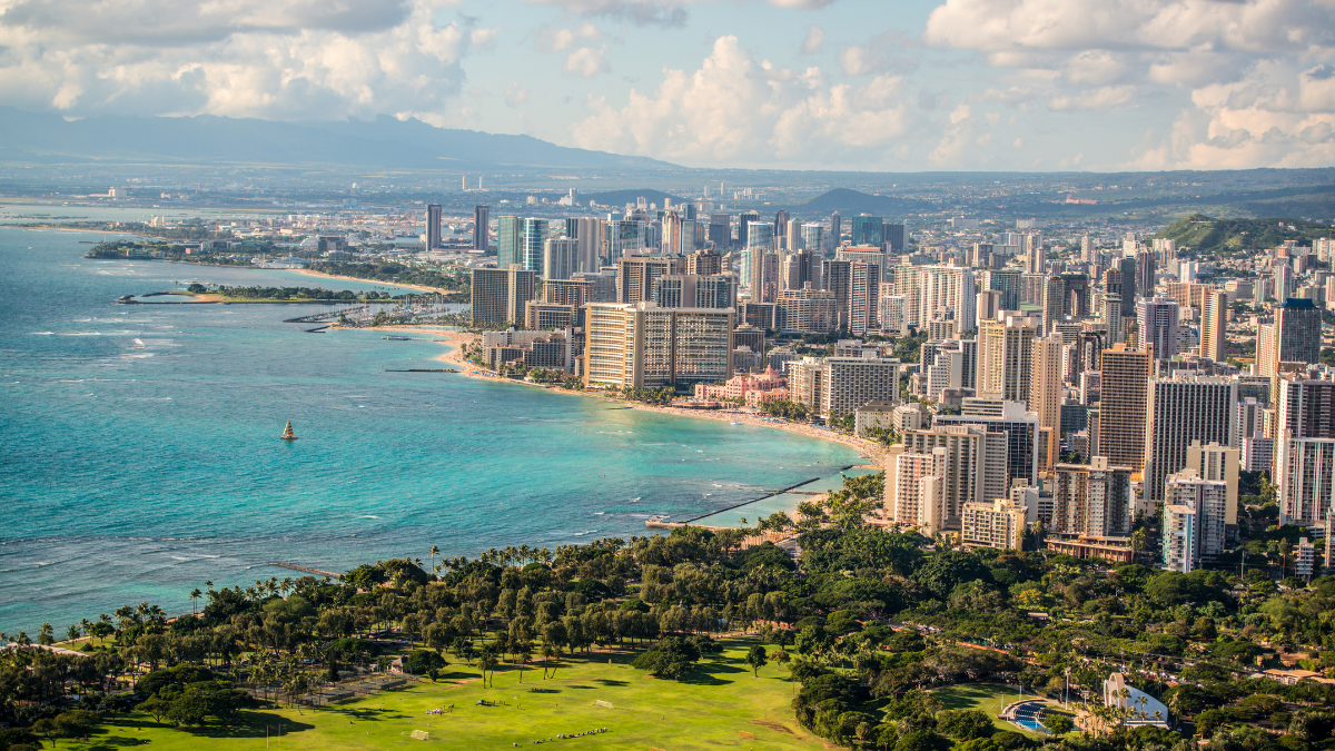 bucket list oahu a large body of water with Diamond Head in the background