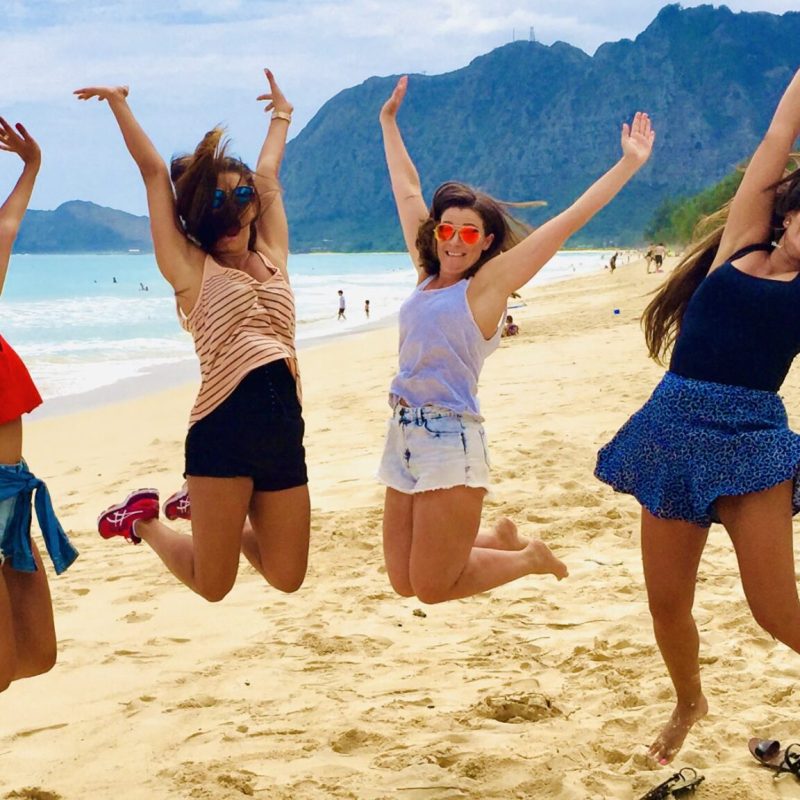 a group of people on a beach