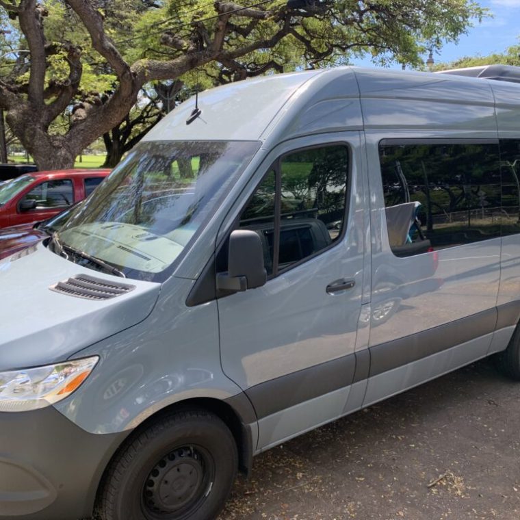 a van parked on the side of a road