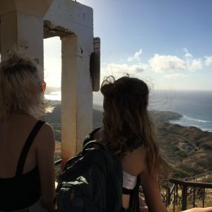 a woman standing in front of a building