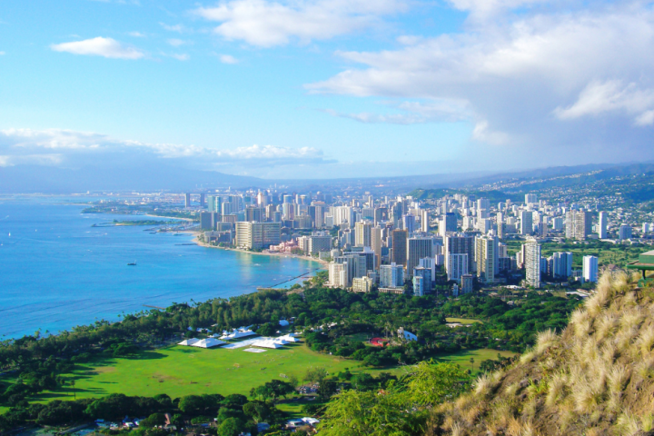 a view of a large body of water with Diamond Head in the background