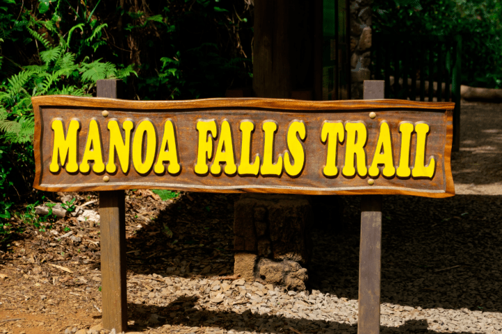 a sign on a wooden bench
