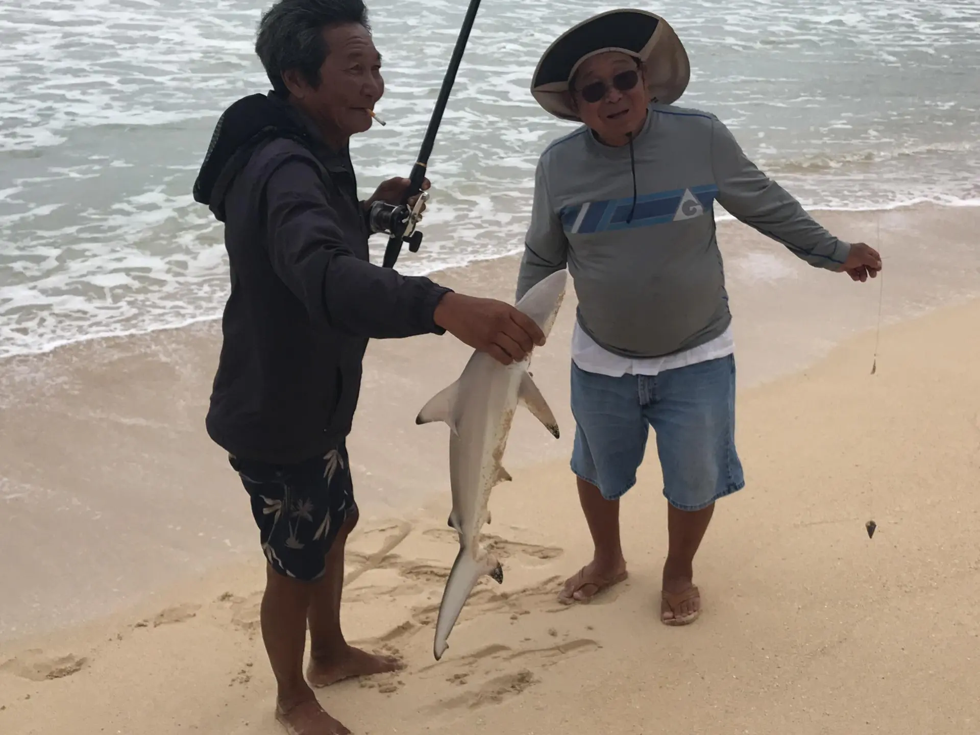 a person standing next to a body of water