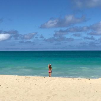 a man standing on top of a sandy beach