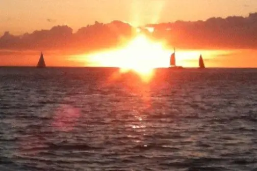 a sunset over a body of water