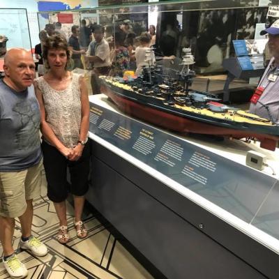 a group of people standing in front of a store