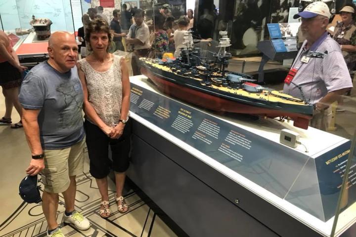 a group of people standing in front of a store