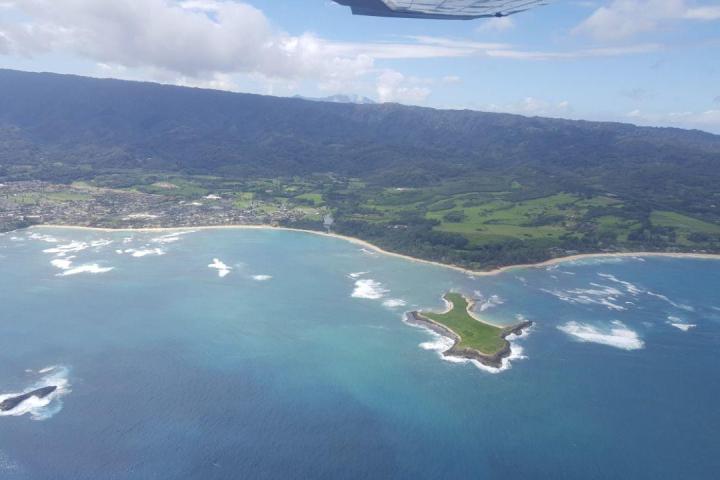 a view of a large body of water with a mountain in the background