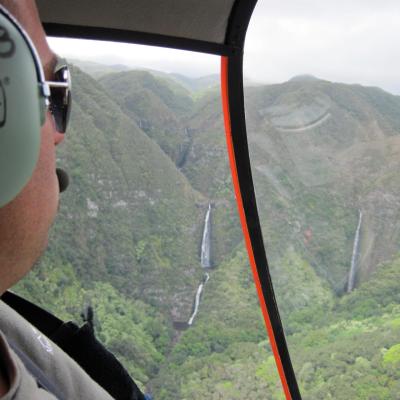 a close up of a man driving a car