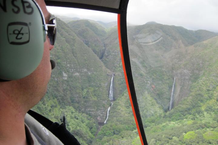 a close up of a man driving a car