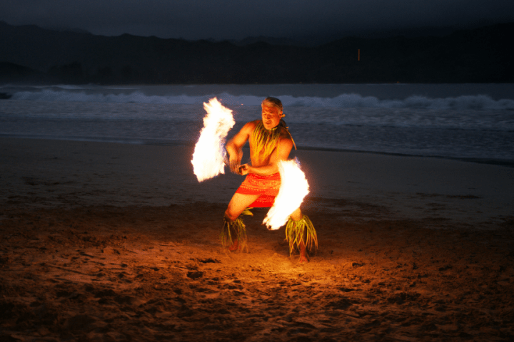 a person holding a frisbee in a body of water