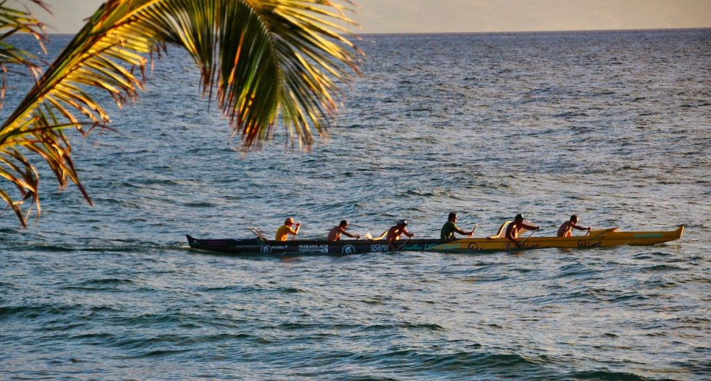 a group of people in a boat on a body of water
