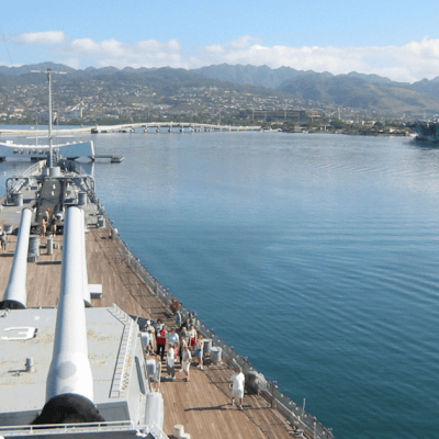 a boat is docked next to a body of water
