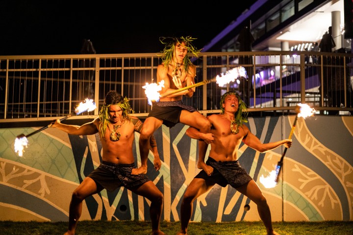 a group of people sitting at night