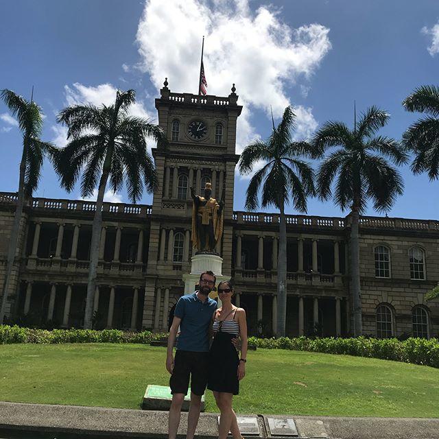 a person standing in front of a clock tower