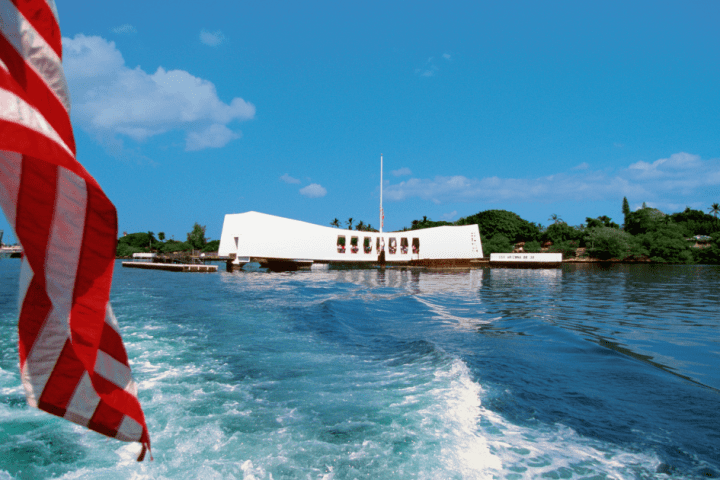 a flag next to a body of water