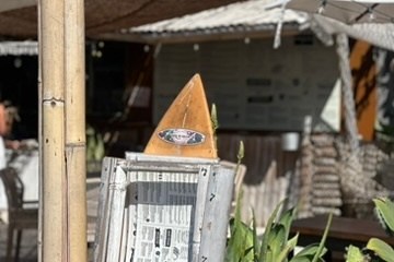 a sign on a wooden table