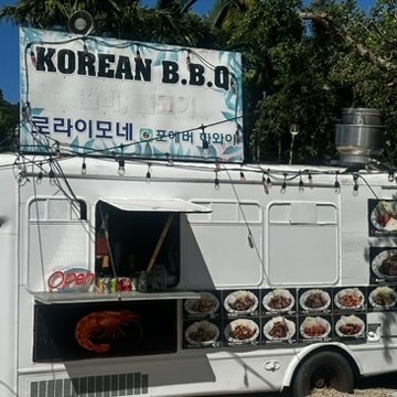 a truck is parked in front of a sign