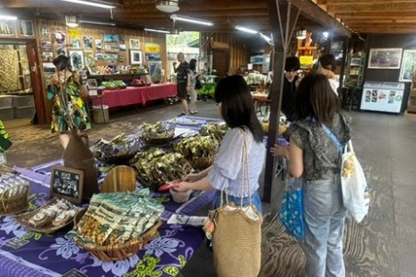 a woman standing in front of a store