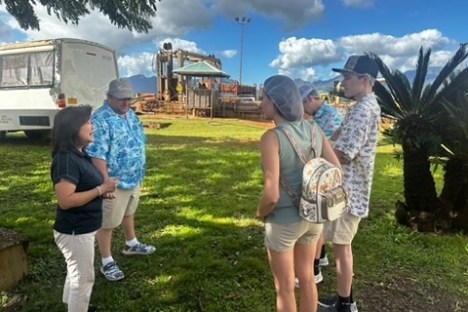 a couple of people that are standing in the grass